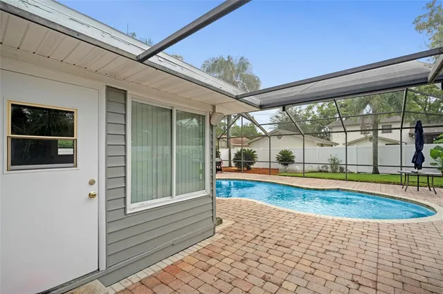 a view of swimming pool with a patio