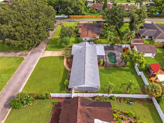 an aerial view of a house with a swimming pool