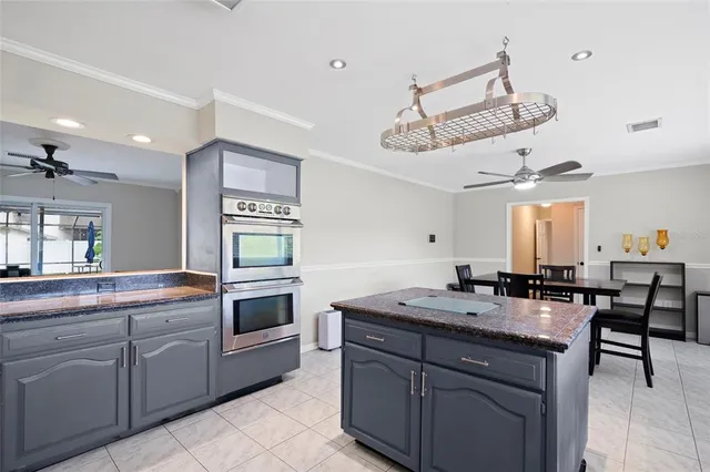 a kitchen with a sink stove and microwave