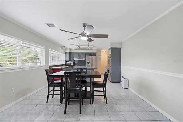 a view of a dining room that has a table and chairs