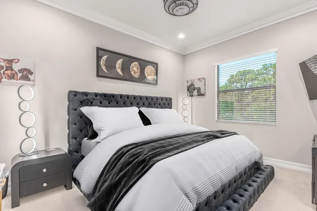 a bedroom with furniture and a window