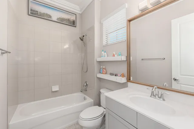 a bathroom with a sink a vanity and a window