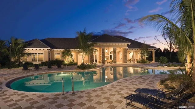 an aerial view of a house with a garden and swimming pool