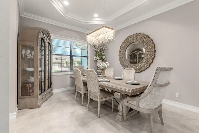 a view of a dining room with furniture and window