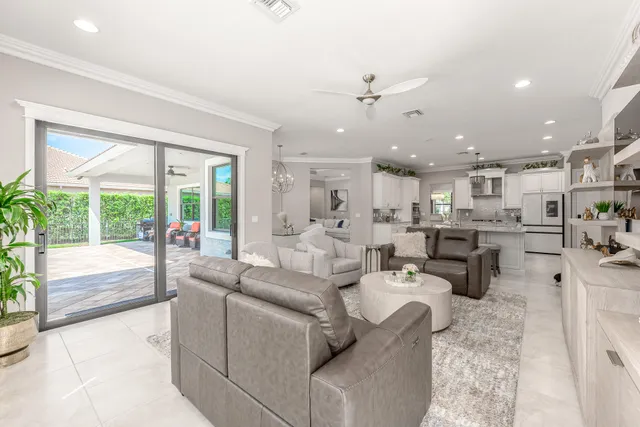 a large kitchen with kitchen island a sink stainless steel appliances and cabinets