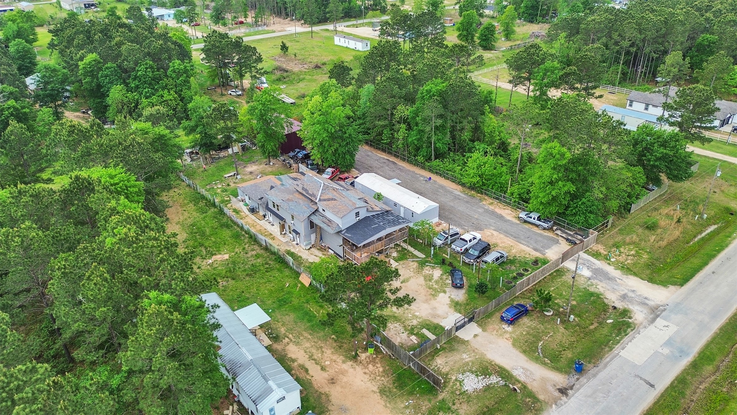 137 County Road 5023 Cleveland, TX 77327 - Photo 2 of 49 an aerial view of a house with a yard basket ball court and outdoor seating