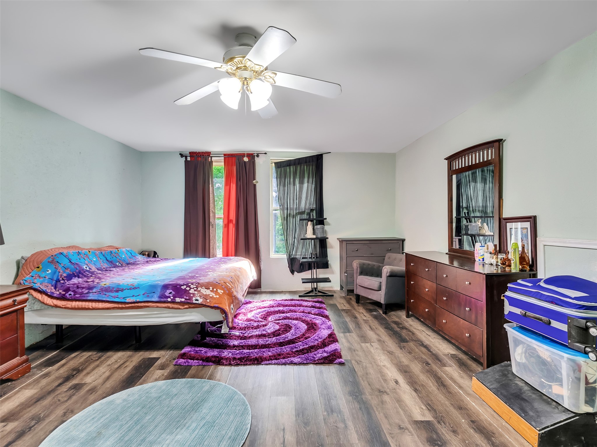 137 County Road 5023 Cleveland, TX 77327 - Photo 21 of 49 a bedroom with a bed and wooden floor