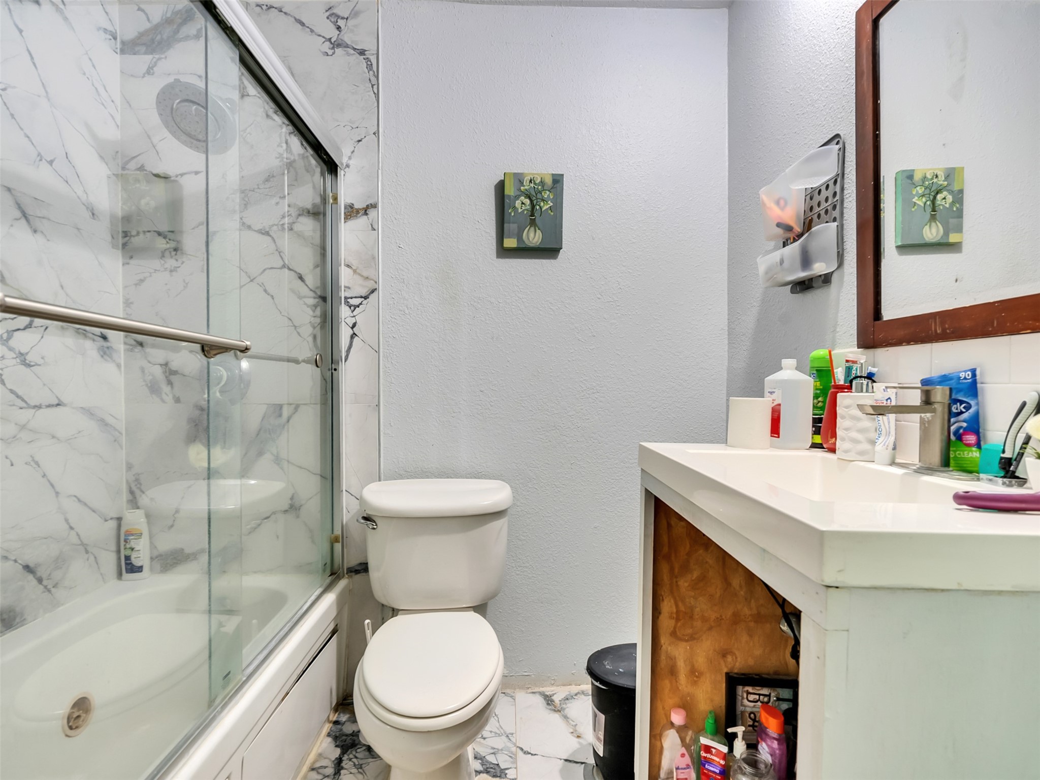 137 County Road 5023 Cleveland, TX 77327 - Photo 22 of 49 a white toilet sitting next to a bathroom sink and tub