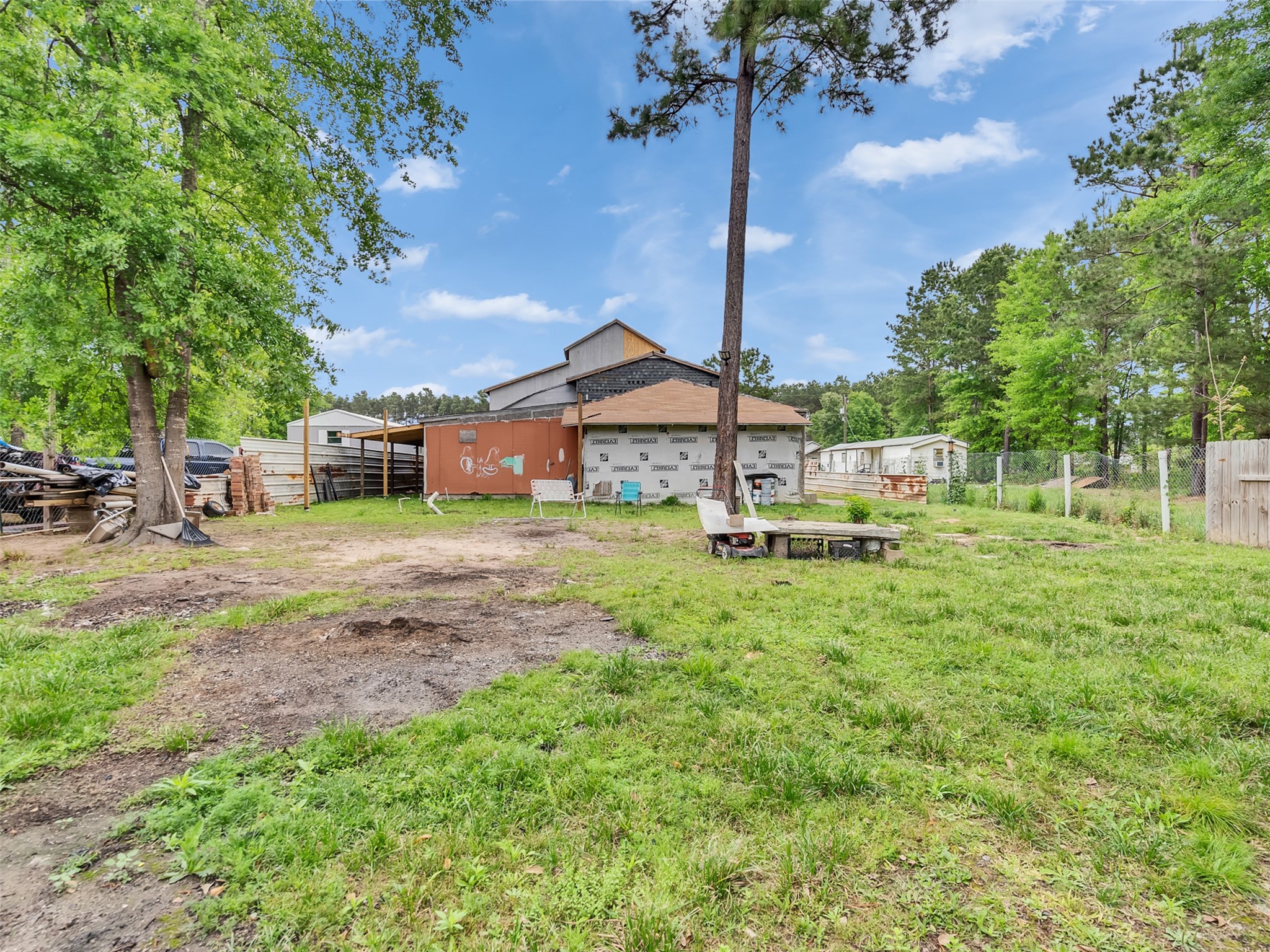 137 County Road 5023 Cleveland, TX 77327 - Photo 49 of 49 a house view with a garden space