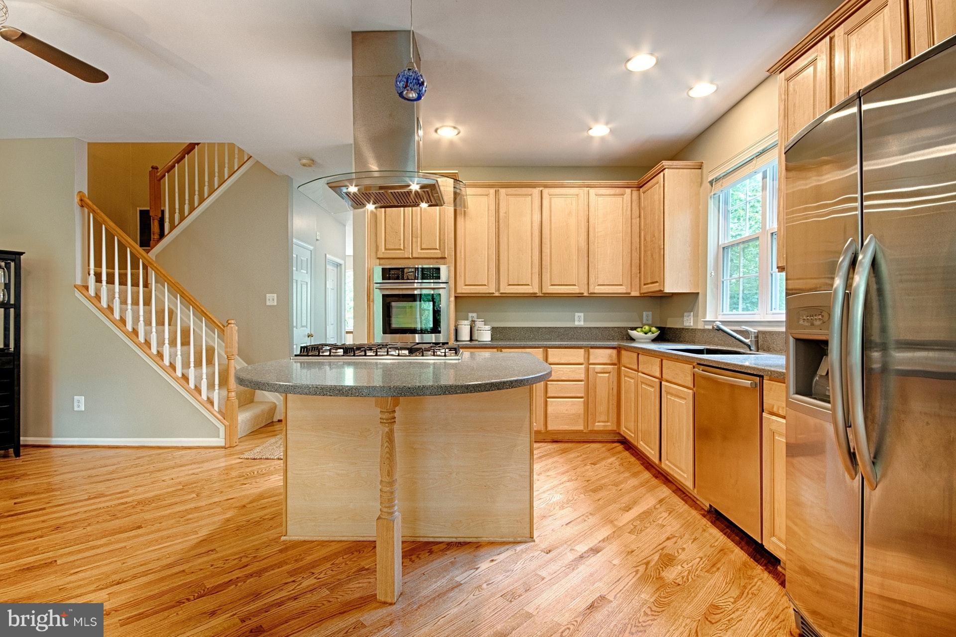 1217 Wild Hawthorn Way Reston, VA 20194 - Photo 10 of 30 Gas cooktop in the center island