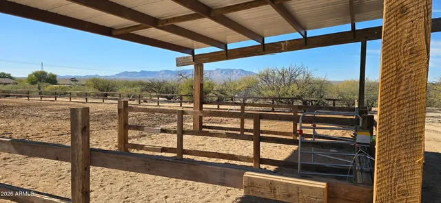 a living room with fireplace furniture and a wooden floor