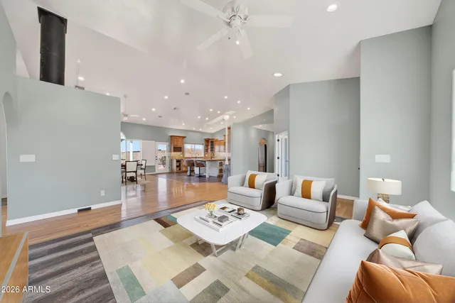 a kitchen with kitchen island granite countertop a stove and a sink