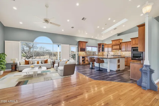 a living room with fireplace furniture and a flat screen tv