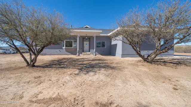 a house view with a backyard space