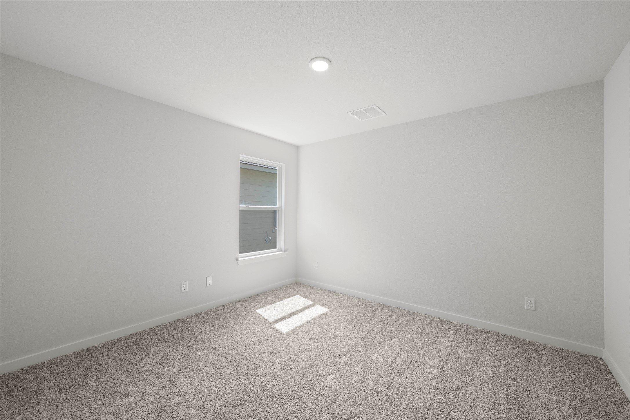 220 Gus Loop Georgetown, TX 78626 - Photo 9 of 18 A well-lit bedroom with carpeted floors, ready for personalization.