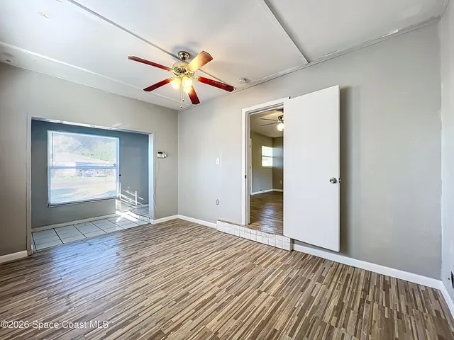 a view of an empty room and window