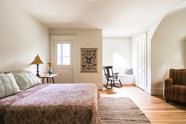 a bedroom with a bed and a table