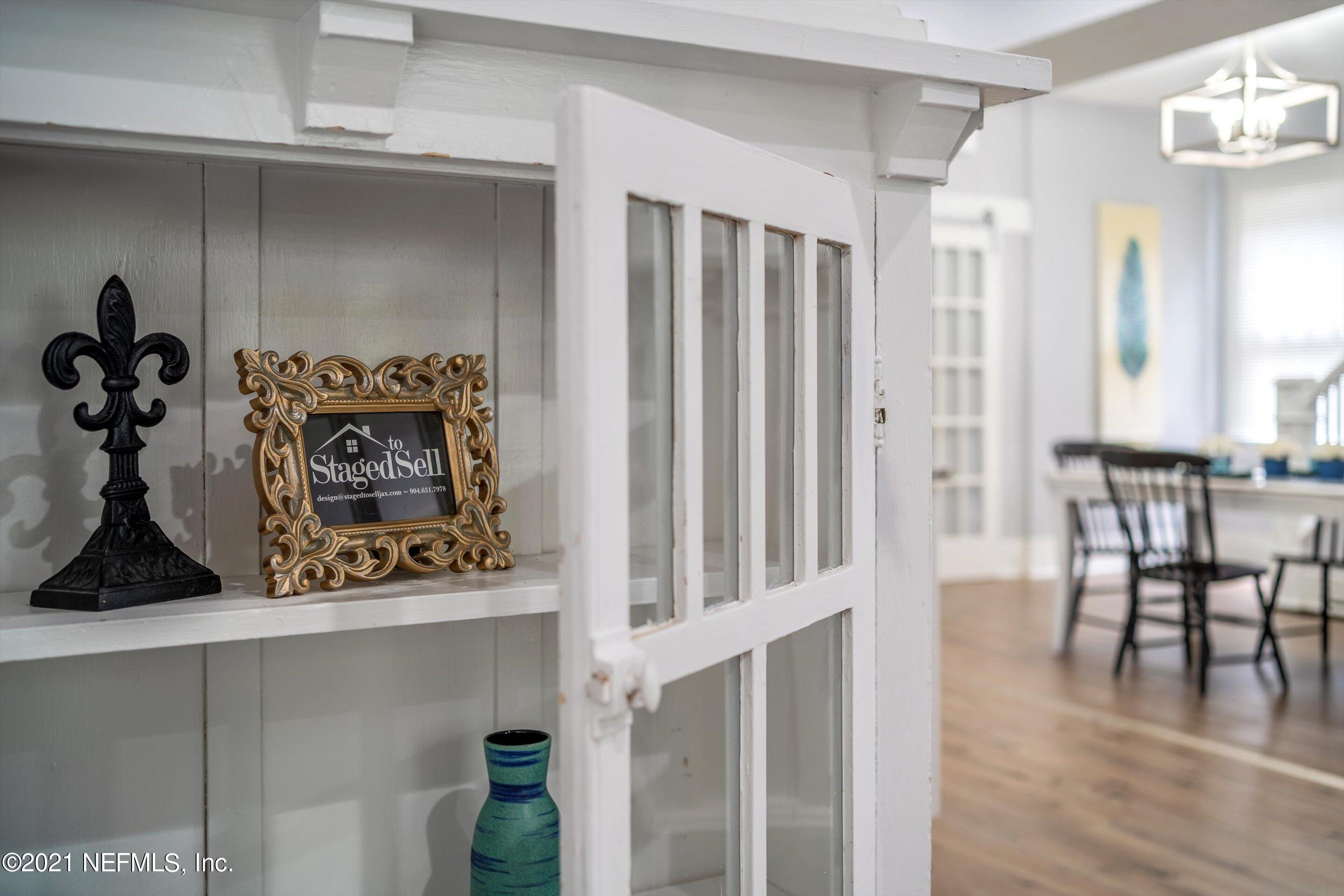 310 West 10th Street Jacksonville, FL 32206 - Photo 13 of 34 a view of a hallway with wooden floor and staircase