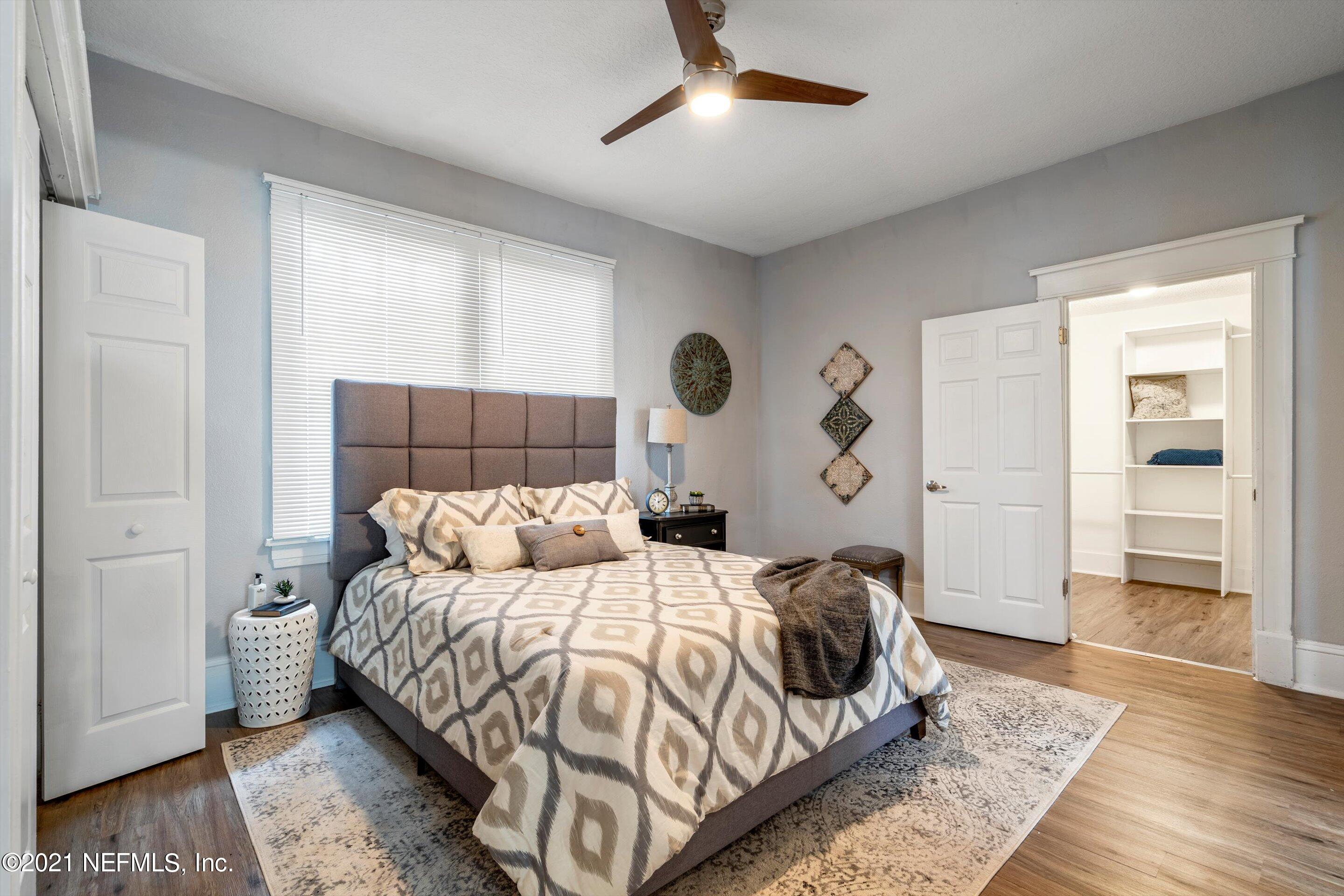 310 West 10th Street Jacksonville, FL 32206 - Photo 24 of 34 a bedroom with a bed and walk in closet