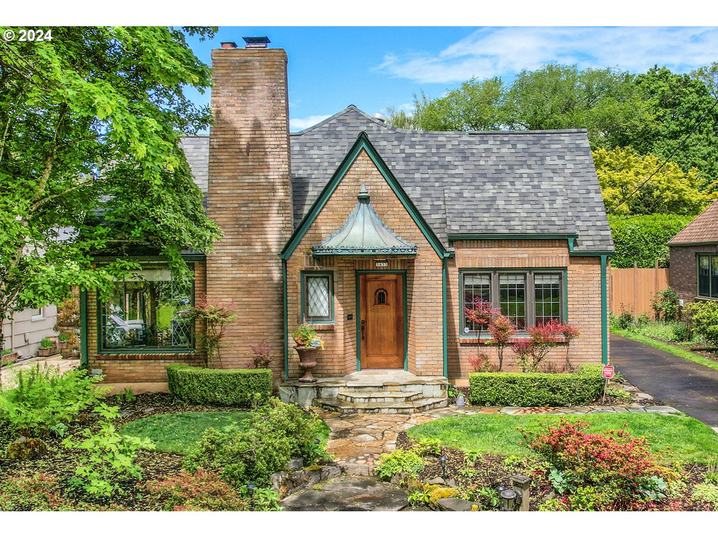 a front view of a house with garden