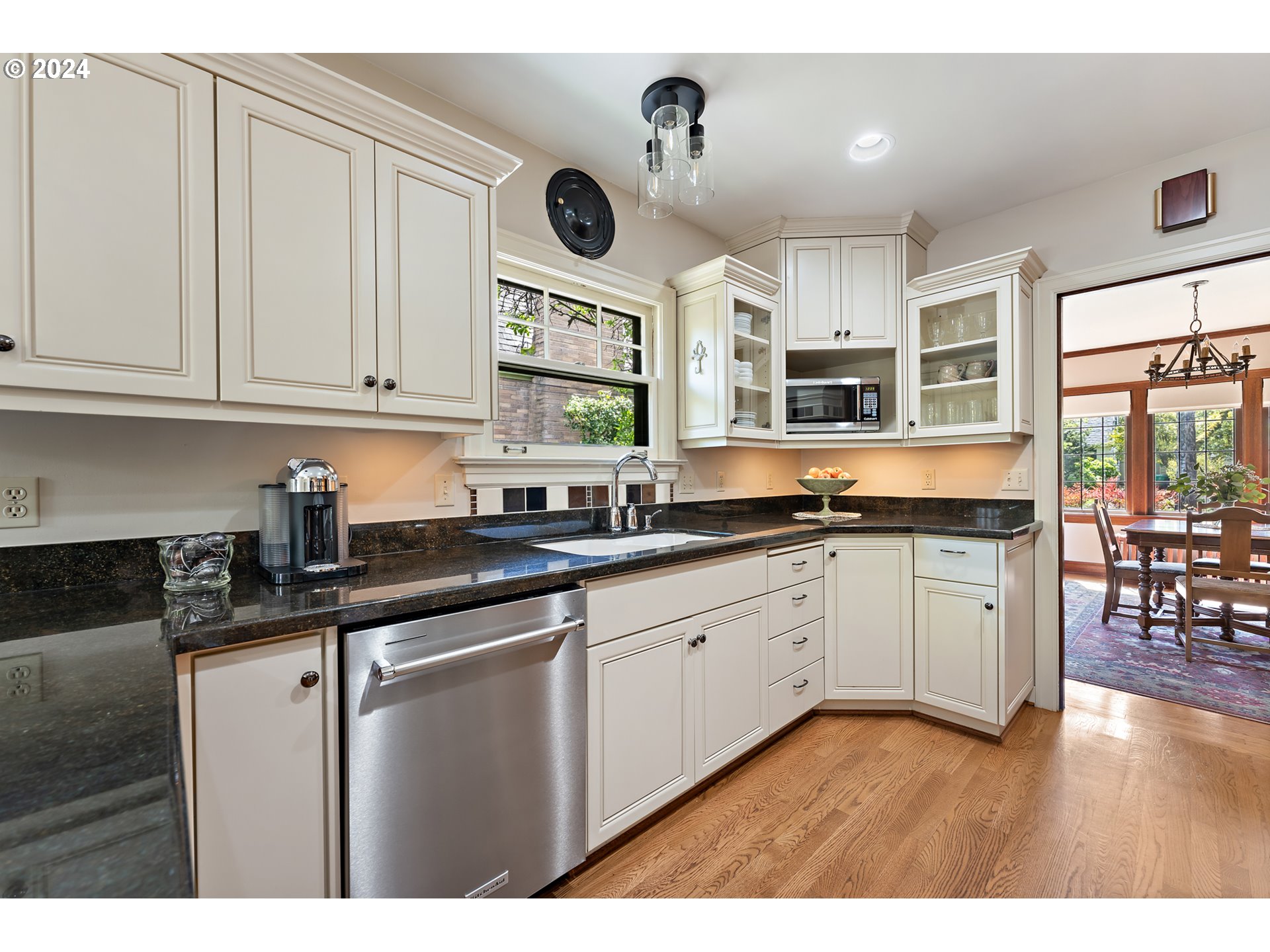 3433 Southeast Henry Street Portland, OR 97202 - Photo 13 of 48 a kitchen with stainless steel appliances granite countertop a stove sink and cabinets