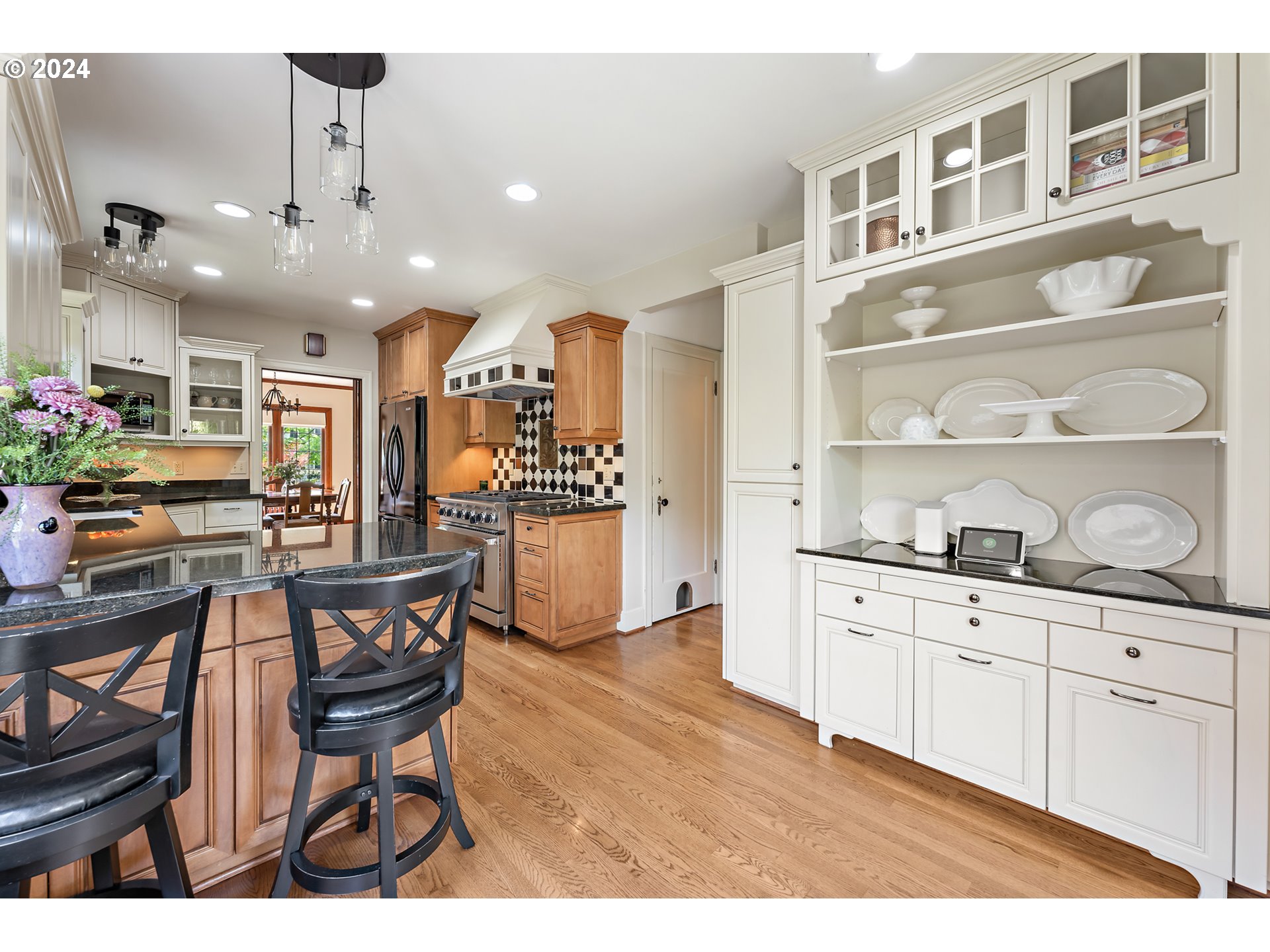 3433 Southeast Henry Street Portland, OR 97202 - Photo 16 of 48 a open kitchen with cabinets a sink and appliances