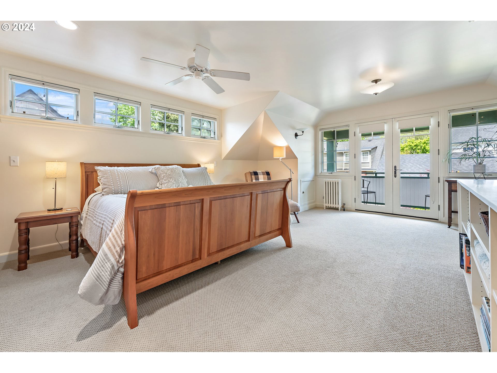 3433 Southeast Henry Street Portland, OR 97202 - Photo 19 of 48 a spacious bedroom with a bed and a cabinets