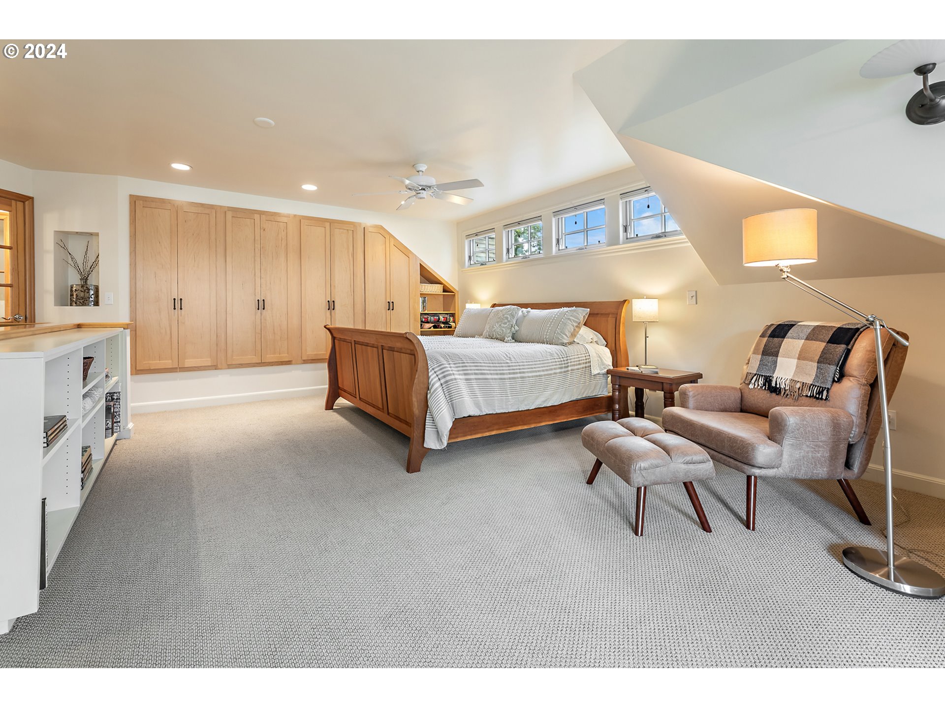 3433 Southeast Henry Street Portland, OR 97202 - Photo 21 of 48 a living room with a couch and a potted plant