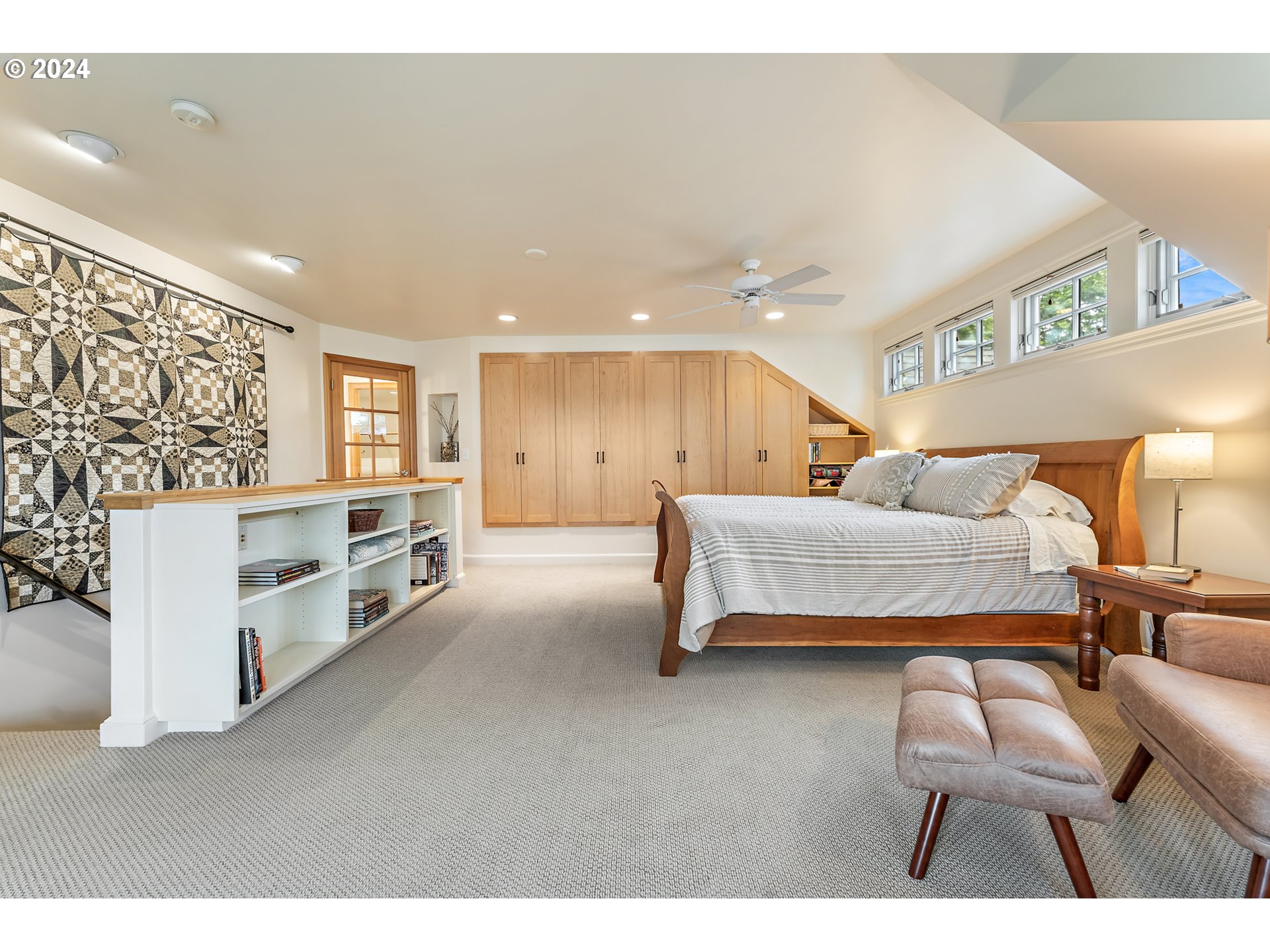 3433 Southeast Henry Street Portland, OR 97202 - Photo 22 of 48 a bedroom with furniture and a lamp