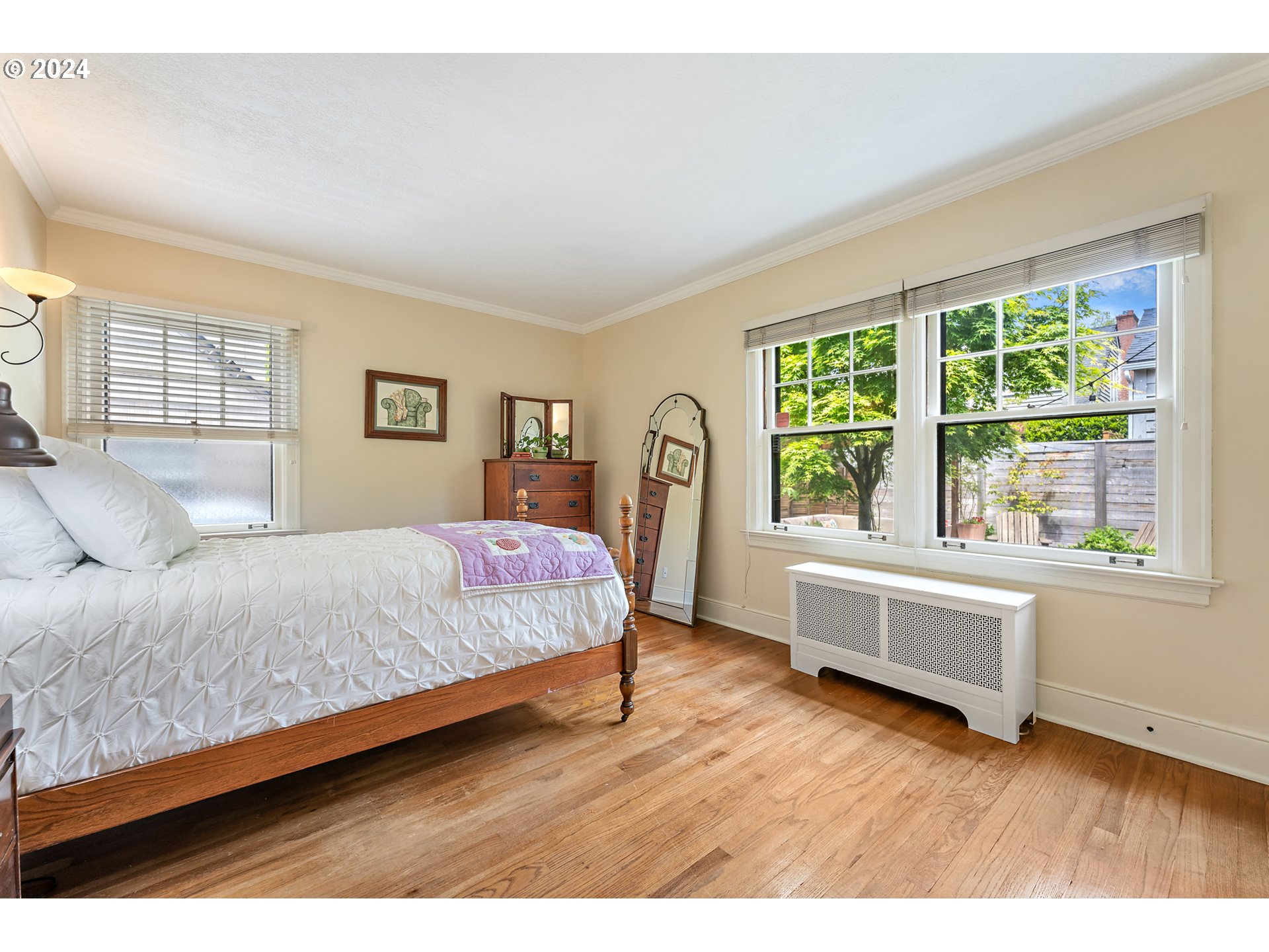 3433 Southeast Henry Street Portland, OR 97202 - Photo 27 of 48 a bedroom with a bed and a large window