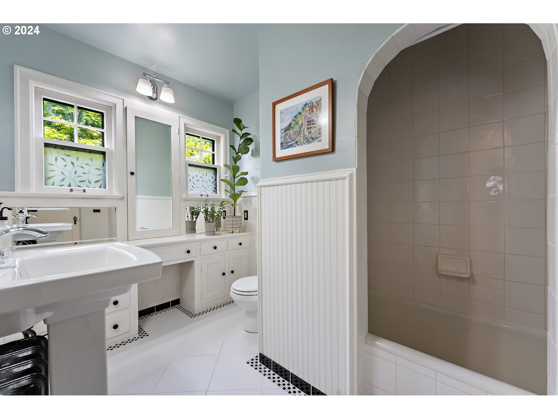3433 Southeast Henry Street Portland, OR 97202 - Photo 29 of 48 a bathroom with a sink and a mirror