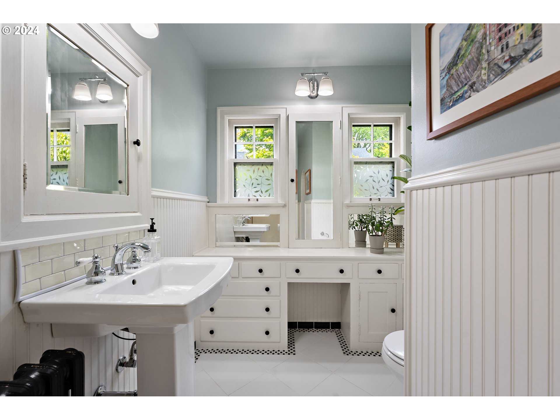 3433 Southeast Henry Street Portland, OR 97202 - Photo 30 of 48 a bathroom with a sink mirror and a window