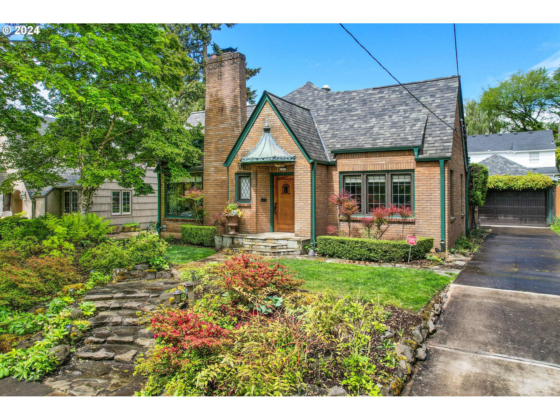 3433 Southeast Henry Street Portland, OR 97202 - Photo 3 of 48 a view of a house with wooden fence next to a yard