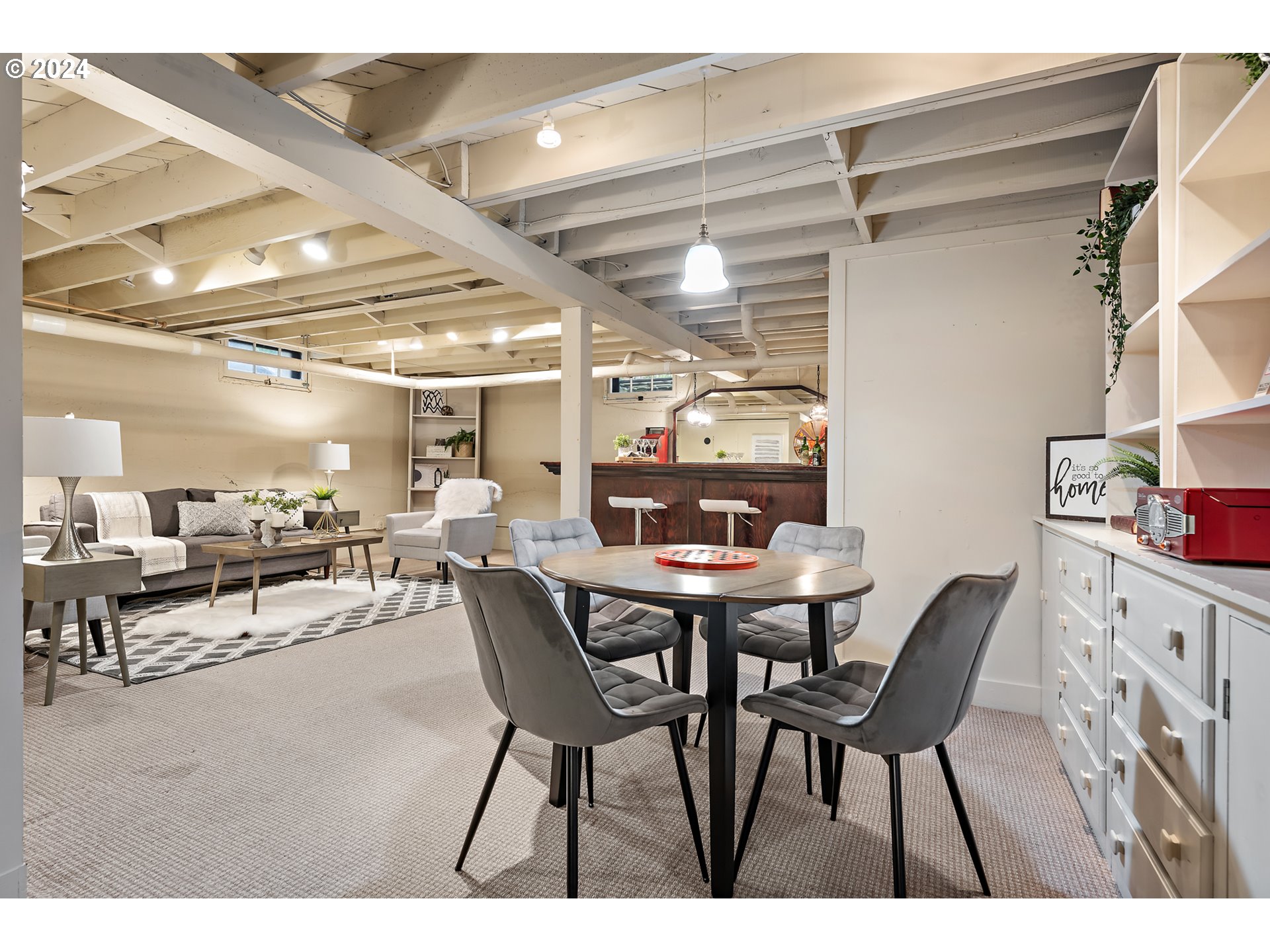 3433 Southeast Henry Street Portland, OR 97202 - Photo 31 of 48 a view of a dining room with furniture and a chandelier