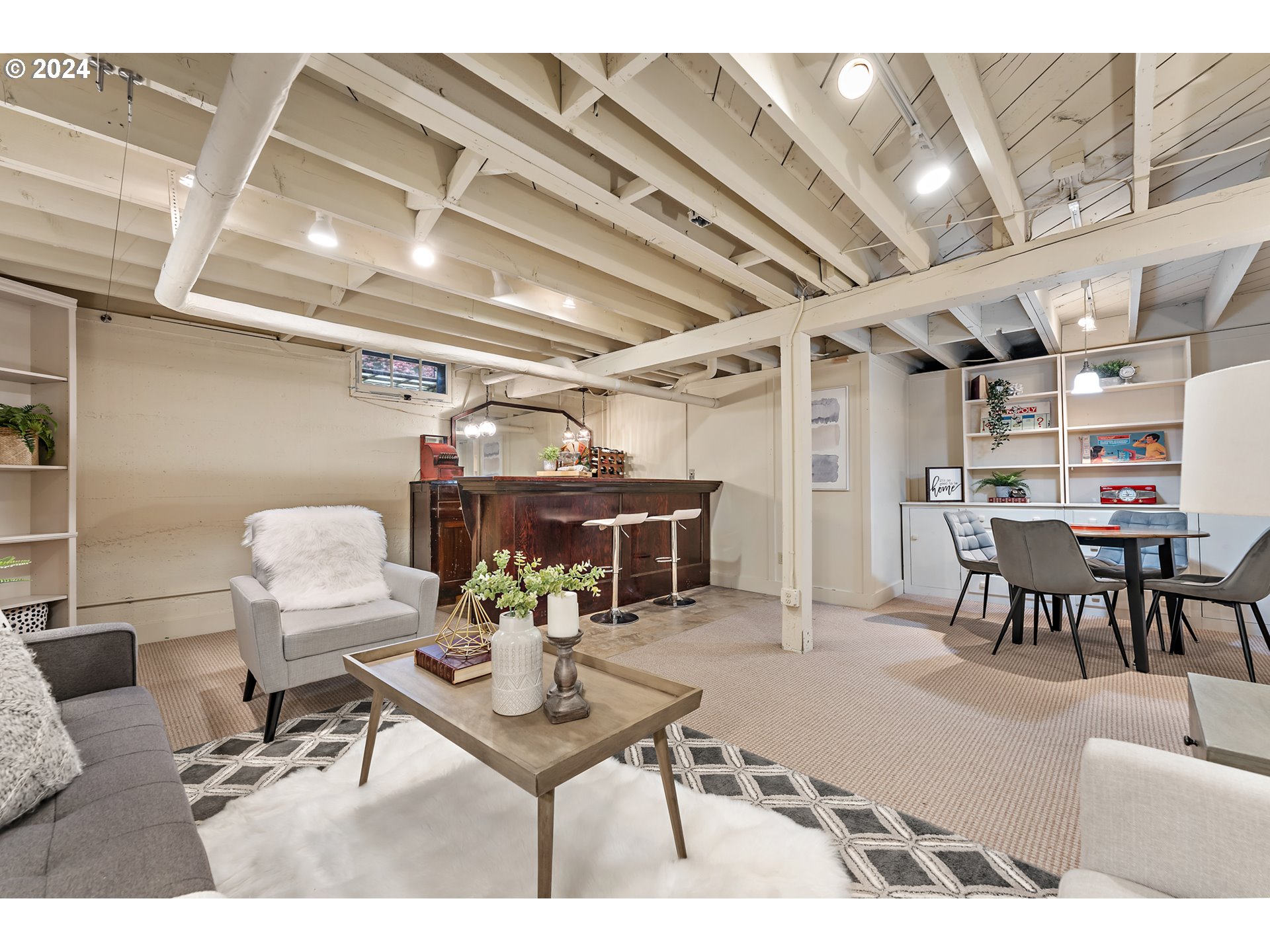 3433 Southeast Henry Street Portland, OR 97202 - Photo 32 of 48 a living room with furniture and a chandelier