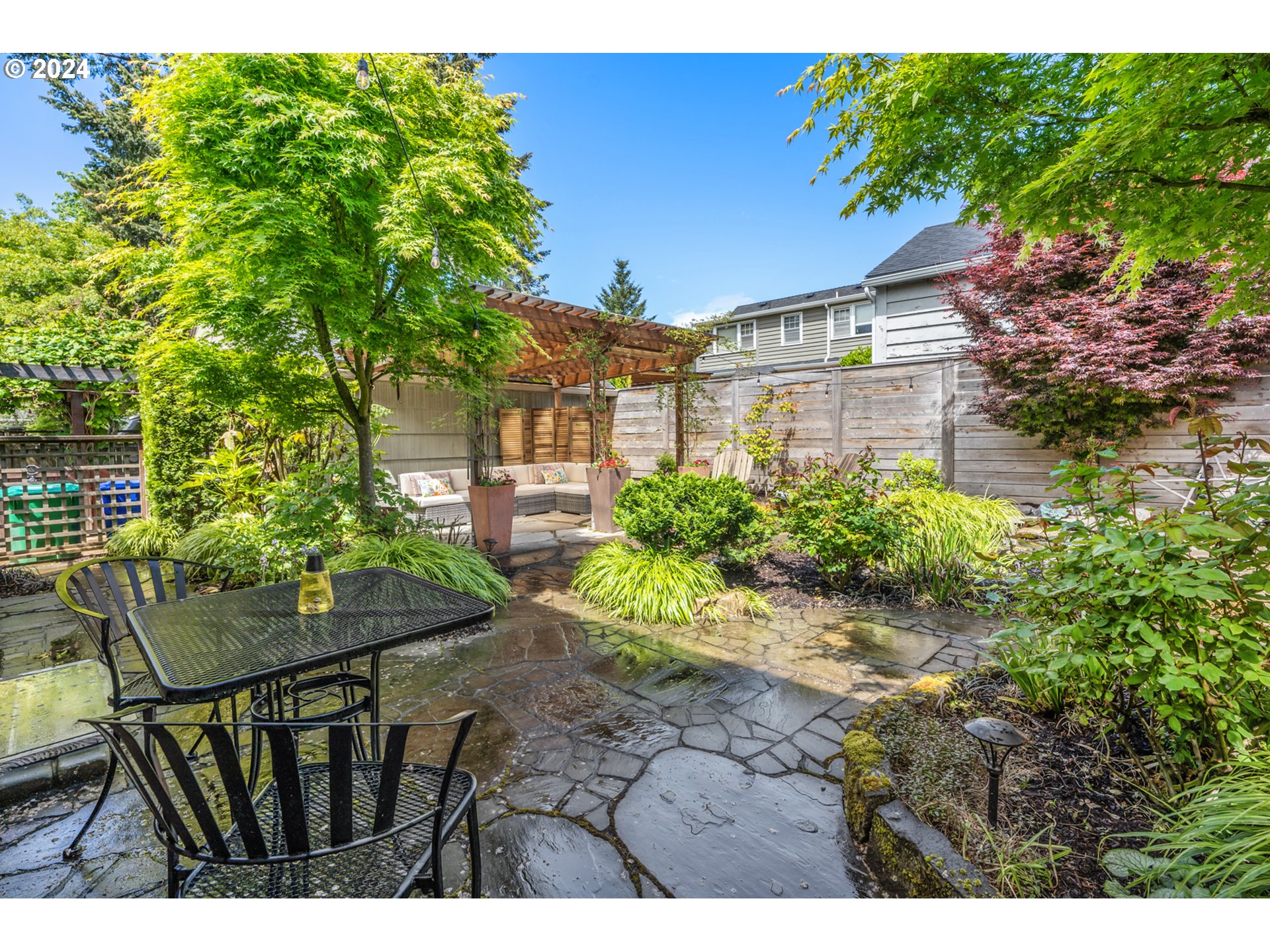 3433 Southeast Henry Street Portland, OR 97202 - Photo 38 of 48 a view of an chairs and table in the backyard