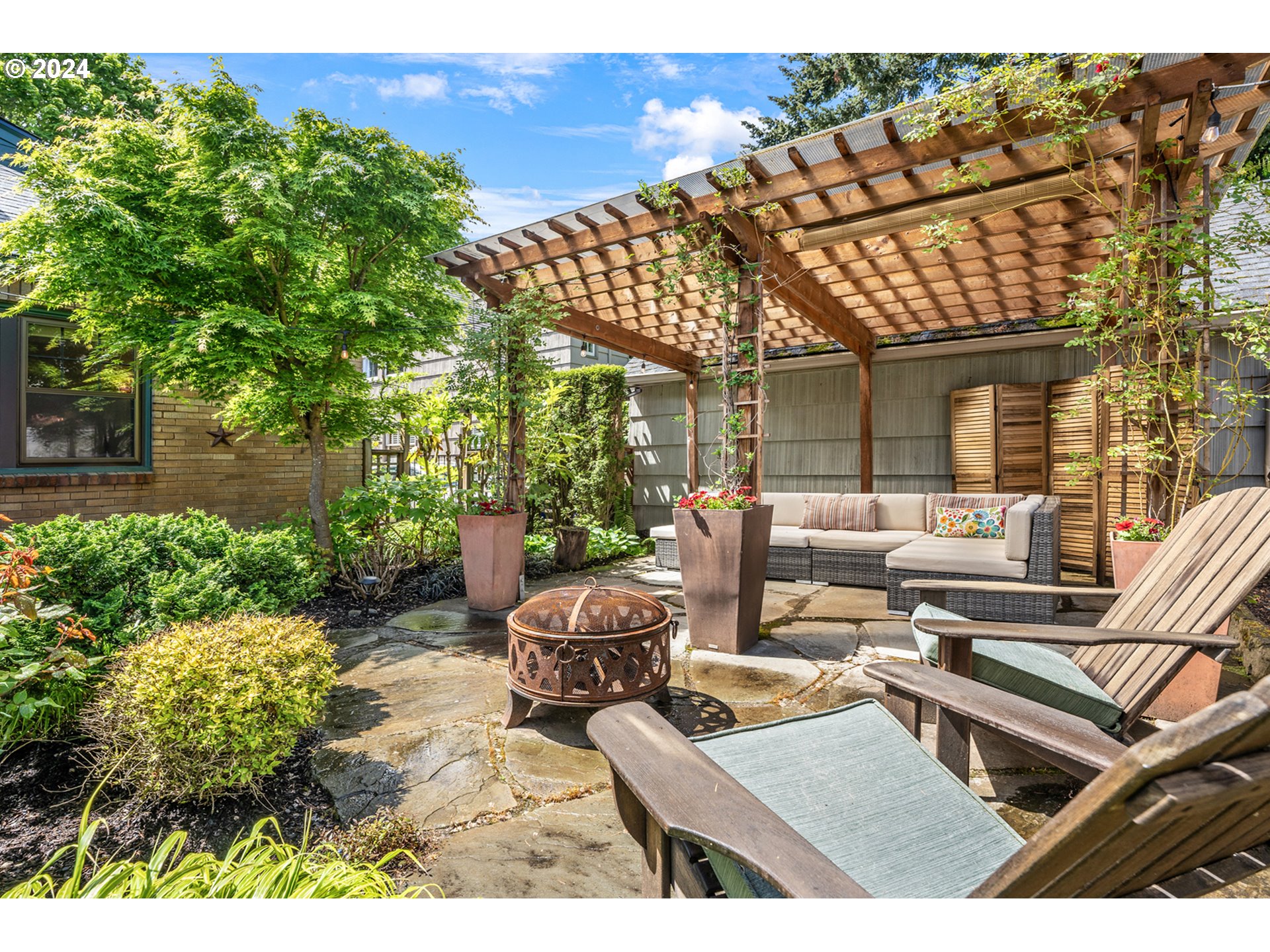 3433 Southeast Henry Street Portland, OR 97202 - Photo 41 of 48 a view of a patio with couches table and chairs and potted plants