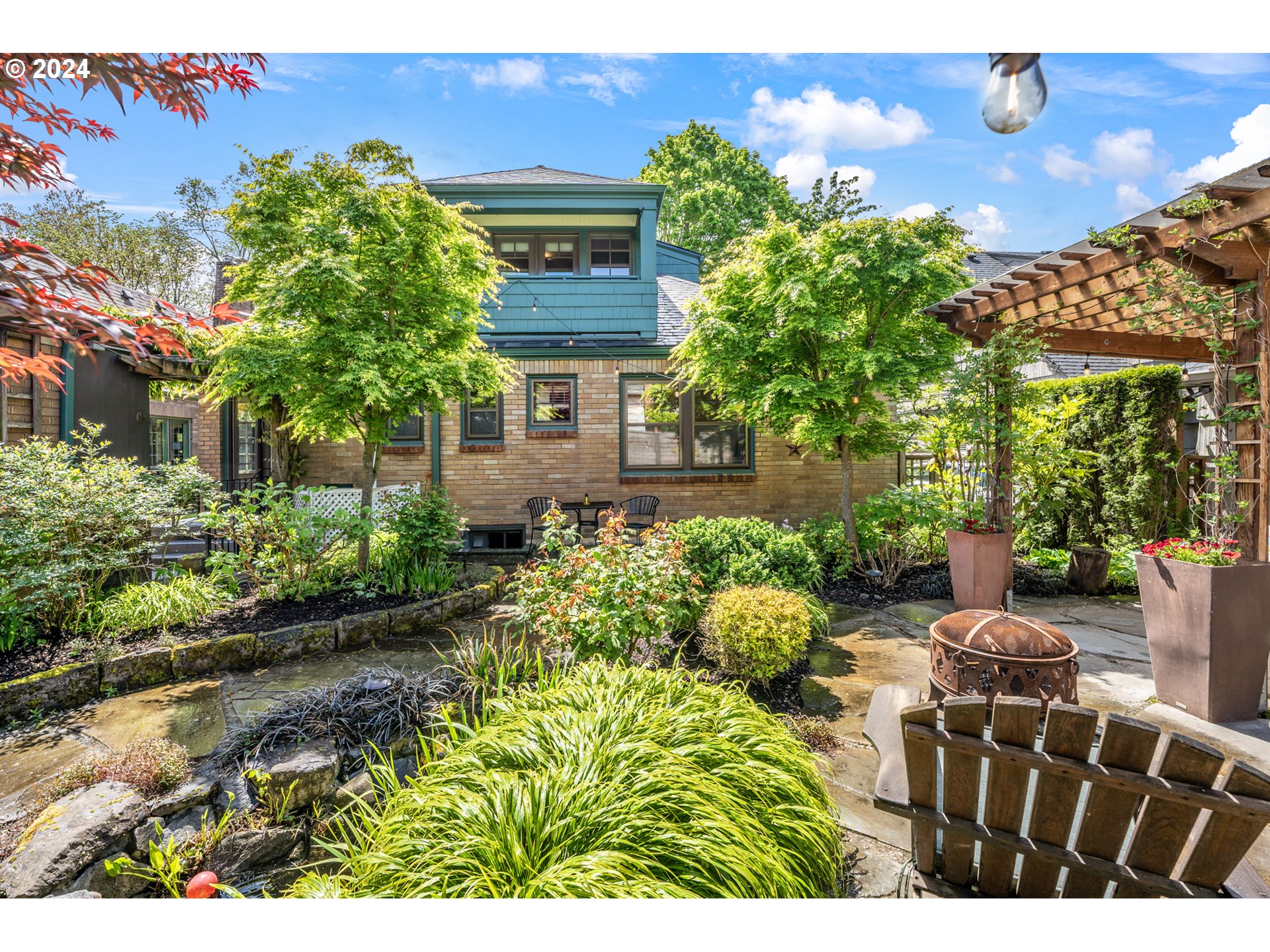 3433 Southeast Henry Street Portland, OR 97202 - Photo 44 of 48 a view of backyard with outdoor seating and green space
