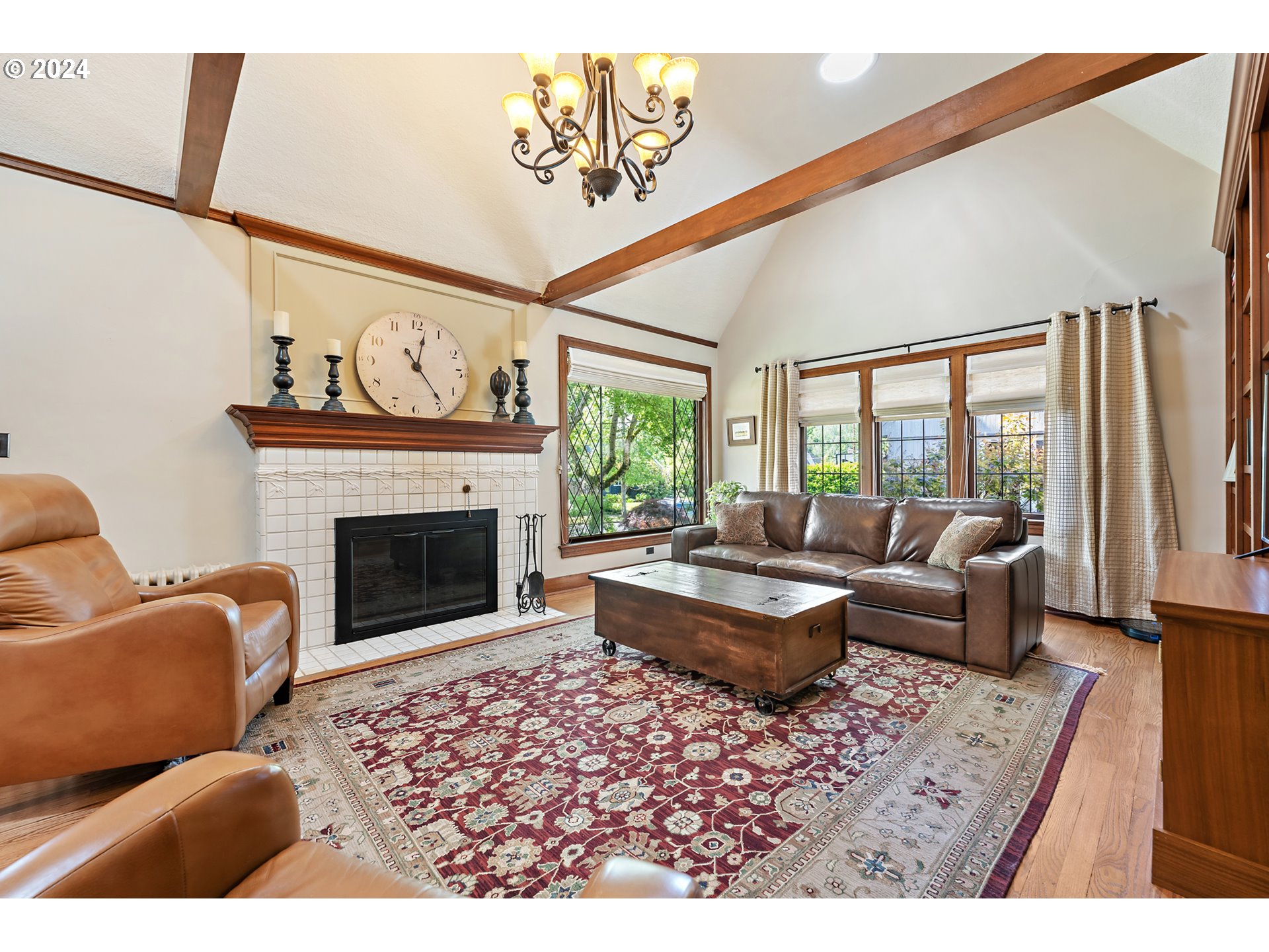 3433 Southeast Henry Street Portland, OR 97202 - Photo 6 of 48 a living room with furniture a large window and a fireplace