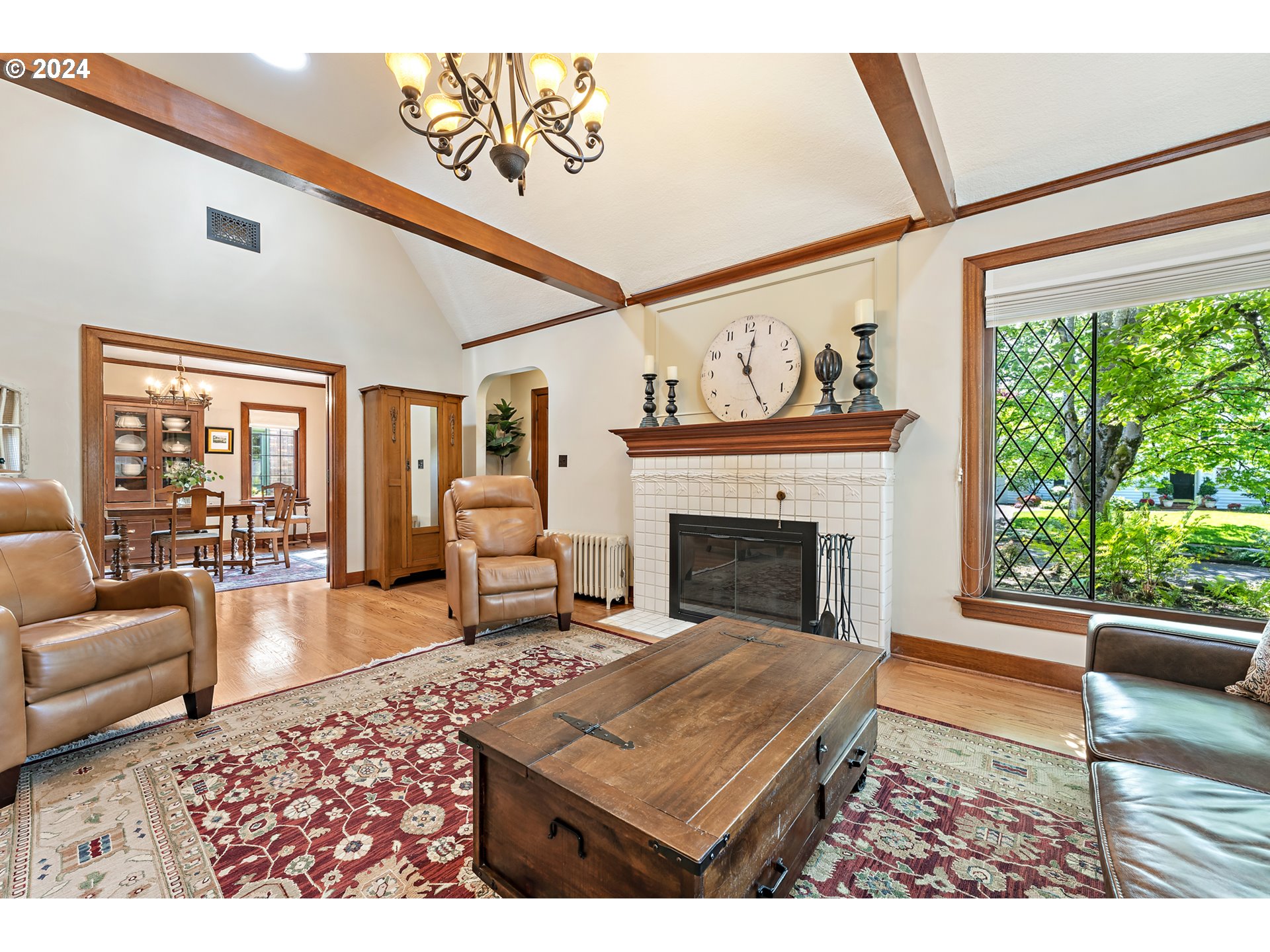 3433 Southeast Henry Street Portland, OR 97202 - Photo 8 of 48 a living room with furniture a rug and a fireplace