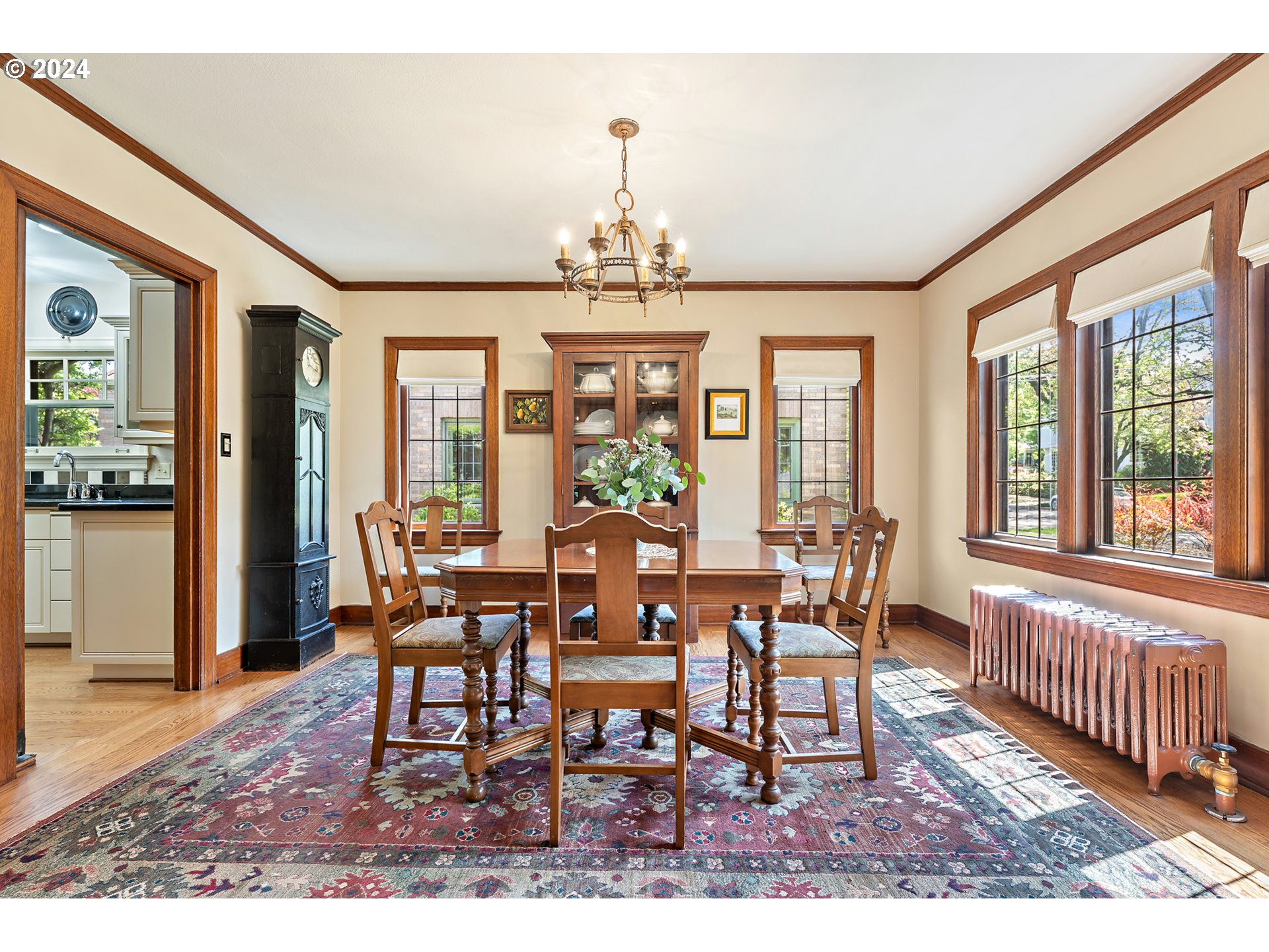 3433 Southeast Henry Street Portland, OR 97202 - Photo 9 of 48 a view of a dining room with furniture windows and wooden floor