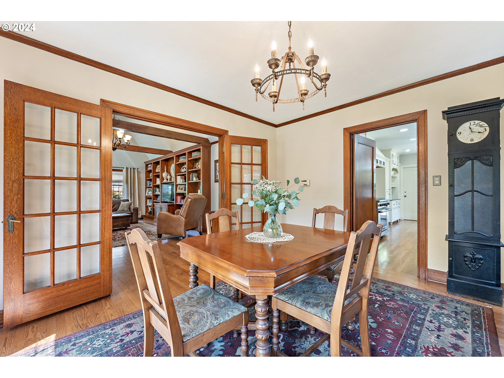 3433 Southeast Henry Street Portland, OR 97202 - Photo 10 of 48 a dining room with furniture a rug a potted plant and a chandelier