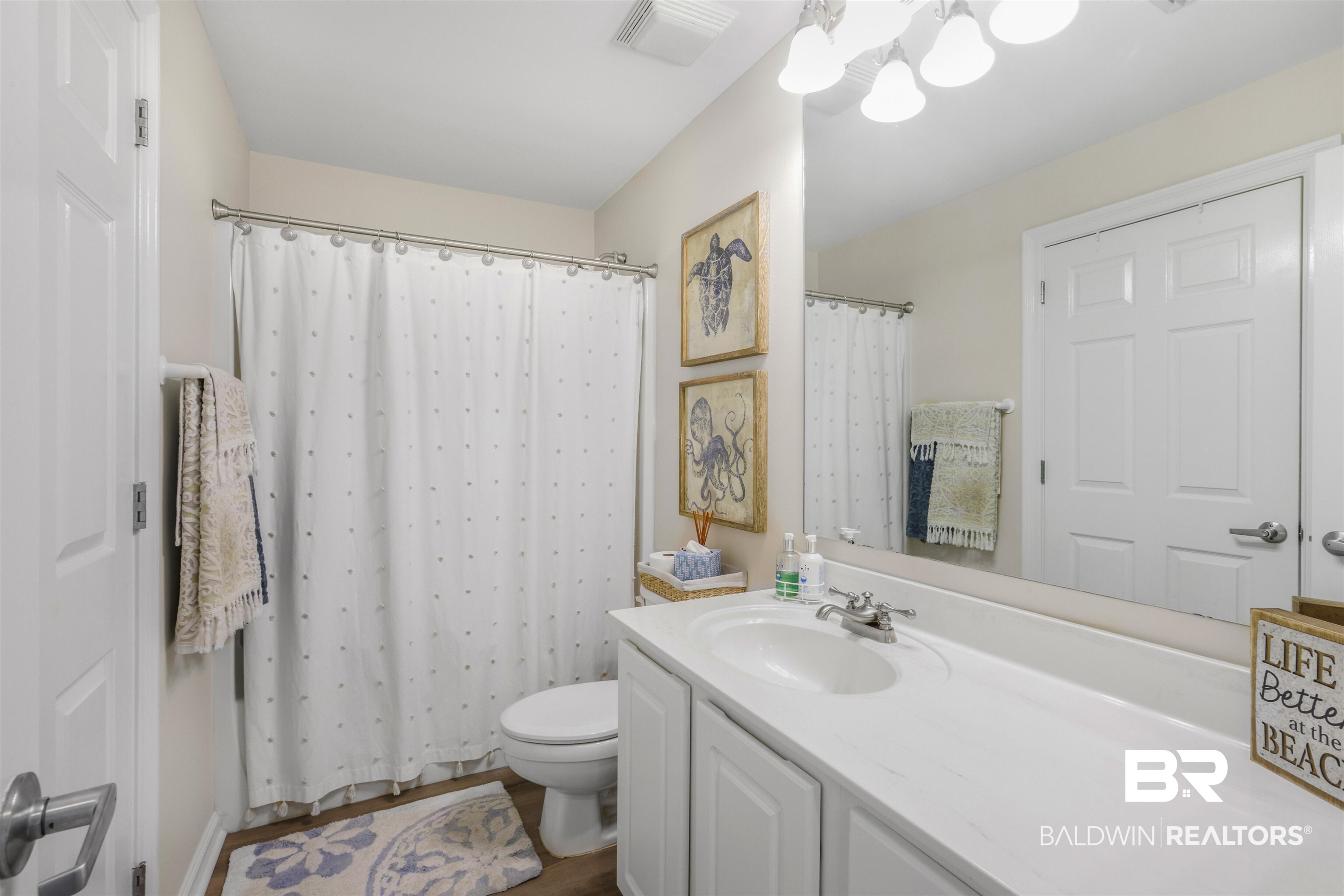 27282 Canal Road, Unit 511 Orange Beach, AL 36561 - Photo 17 of 29 Bathroom with vanity and curtained shower