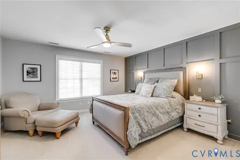 a bedroom with a bed and a couch