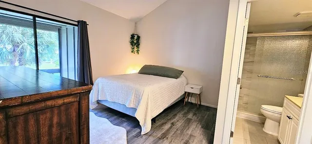 a view of a livingroom with furniture and a flat screen tv