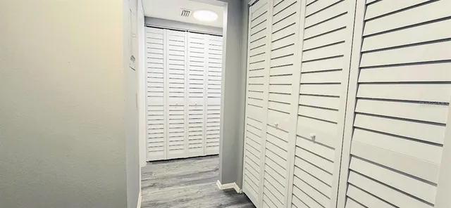 a view of a balcony with wooden floor