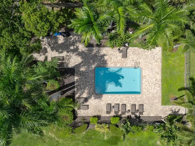 a front view of multi story residential apartment building with yard