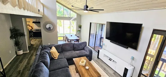 a living room with furniture and stairs