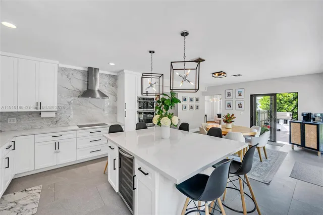 a view of a kitchen and dining room