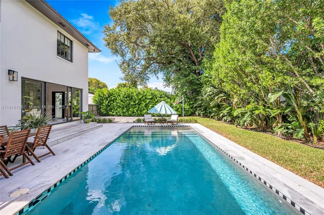 a view of a patio with swimming pool